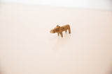 Handmade bronze hippo sculpture with a distinct rusty patina and compact shape.