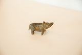 Vintage bronze hippo viewed from above, highlighting its turning head and rustic patina.