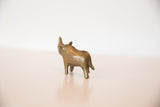 The powerful back and turning stance of a vintage African bronze rhino sculpture.