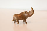 Vintage African copper rhino sculpture displaying its unique form and rich aged patina.