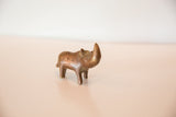 The charming, handmade form of a vintage copper rhino with an aged patina.