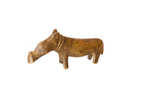 Vintage handmade African skinny bronze hippo with a golden-brown, aged patina.