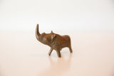 Textured head and upward horn of the vintage African copper rhino.