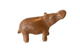 Vintage African handmade copper hippo figurine with a warm, rustic patina.