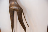 Vintage bronze giraffe hind legs and tail with textured print and rich patina.
