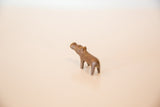 High-angle view showing the charming, handmade form of a vintage copper hippo.