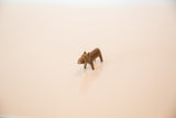 Miniature handmade copper hippo sculpture with aged, bronze-toned patina.