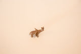 High-angle view of a small African copper elephant highlighting its aged, handmade finish.
