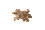 Vintage African copper turtle pendant with a detailed textured shell and aged patina.
