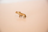 Angled view of the vintage bronze hippo's simple, hand-cast form.