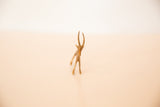 Front view of the vintage mini bronze gazelle highlighting its delicate face and textured horns.