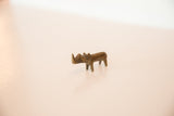 Side profile of a vintage handmade miniature dark bronze rhino sculpture.