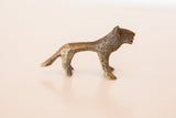 Vintage African bronze mini lion with dark gold patina and textured handmade casting.