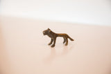 Handmade vintage bronze mini lion sculpture, dark gold patina, standing side profile.