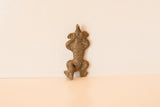 African cast bronze lizard pendant showing its detailed, textured body.