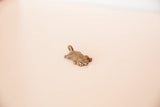Side profile of the vintage cast bronze turtle pendant showing its textured shell.