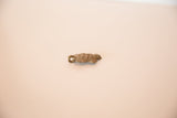 Side angle view of the cast bronze turtle pendant showing its depth and textured patina.