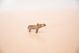 Side profile of the vintage African mini hippo highlighting its handmade shape and dusty bronze patina.