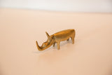 Vintage African bronze rhinoceros sculpture's head, with textured surface and golden patina.