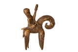 Vintage African bronze sculpture of a warrior riding a stylized animal with an aged patina.