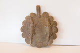 Collector African bronze medallion: top loop with surrounding spirals and time-softened patina.