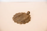 Collector African bronze medallion with hanging loop and aged crocodile details.