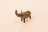 Three-quarter view of a vintage bronze elephant showing its handmade casting texture.