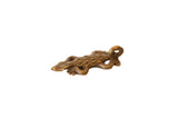 Vintage African bronze spotted lizard pendant with a textured body and a looped tail.