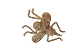 Vintage African bronze insect sculpture with a dark, mottled oxidized patina.