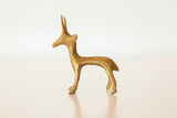 Side profile view of a vintage bronze gazelle sculpture with a textured, handmade finish.