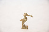 Vintage African crowned stork sculpture, close-up of aged bronze patina and detailed head.