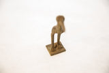 Vintage African bronze stork's textured legs and square base.