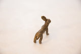 Handmade bronze jack rabbit with textured body and curled tail.