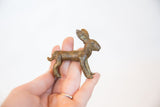 Collectible vintage African bronze jack rabbit sculpture, held in hand, showing patina.
