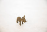 Vintage bronze elephant sculpture with a textured, handmade finish, seen from an angled perspective.