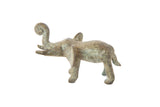 Vintage African oxidized bronze elephant with a curled trunk and aged patina.
