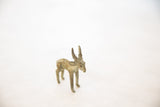 Vintage African bronze impala sculpture seen from a high three-quarter angle.
