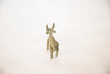 Vintage collectible bronze impala, showing its back, rugged texture, and green patina.