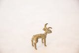 Side and back view of a collectible African bronze antelope with aged patina.