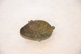 Time-softened green and brown patina with grid-like texture on the vintage copper head.