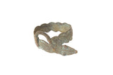 Vintage African bronze snake bracelet with textured details and an aged green patina.
