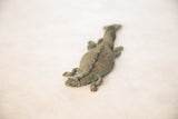 Textured back and aged patina on a vintage African copper crocodile sculpture.