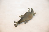 Hollow underside of the vintage African copper crocodile showing its handmade form.