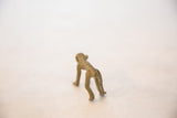 Rear view of a vintage African bronze collector monkey with rich patina.