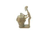 Vintage African oxidized copper drummer sculpture with a stylized, elongated form and aged patina.