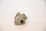 Hollow base and textured, oxidized surface of the vintage copper drummer.