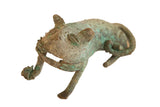 Vintage African oxidized copper feline sculpture with a textured green and brown patina.