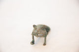 Detailed frontal view of the vintage copper feline's face and oxidized green patina.