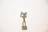 The back of the vintage African copper man, with a slender form and oxidized patina.