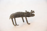 Side profile of the handmade African copper boar, highlighting its rustic texture.